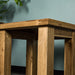 A lower angle of the larger of the two Amstel Oak Nesting Tables.
