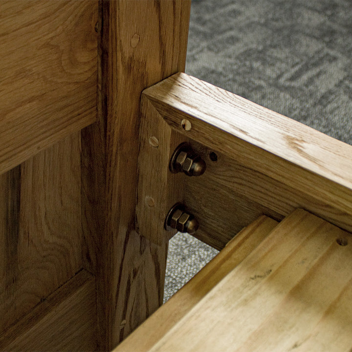 Another view of the strong bolts that connect the side rails to the footboard and headboard of the Amalfi Oak Queen Bed Frame.