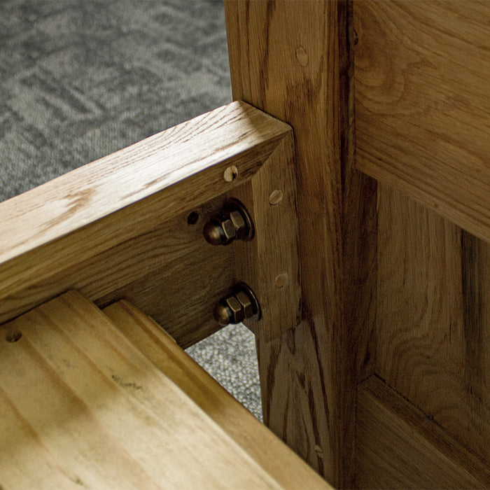 Another view of the strong bolts that connect the side rails to the footboard and headboard of the Amalfi Super King Oak Bed Frame.