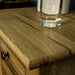 A close up of the top of the Beethoven 3 Drawer Oak Bedside Cabinet showing the wood grain.