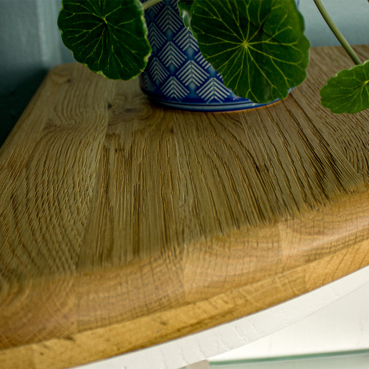 A close up of the top of the Loire Oak Corner Display Unit, showing the wood grain and colour.