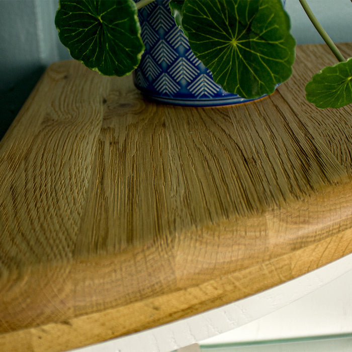 A close up of the top of the Loire Oak Corner Display Unit, showing the wood grain and colour.