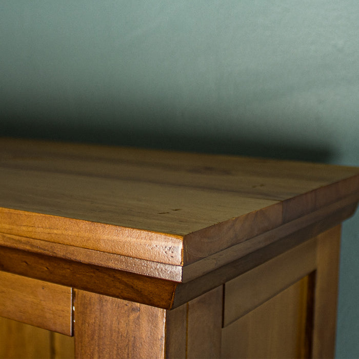 A close up of the top of the Montreal Large Pine Bookcase, showing the wood grain and colour.