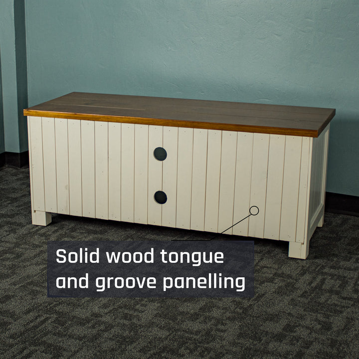 The back of the Alton Entertainment Unit, showing the tongue and groove back panelling and cable holes.