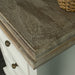 A close up of the top of the Biarritz 3 Drawer Bedside Cabinet, showing the wood grain and colour.
