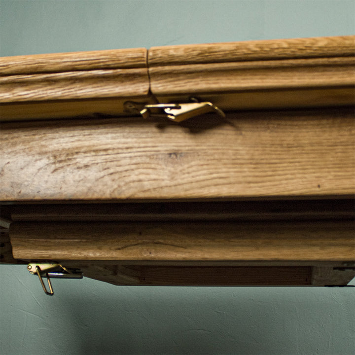 A view of the latch that holds the table together to prevent unwanted extension.