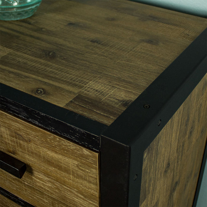 A close up of the top of the Victor 5 Drawer Tallboy showing the wood grain and the painted black wood outline, paired with the brushed black aluminium frame.