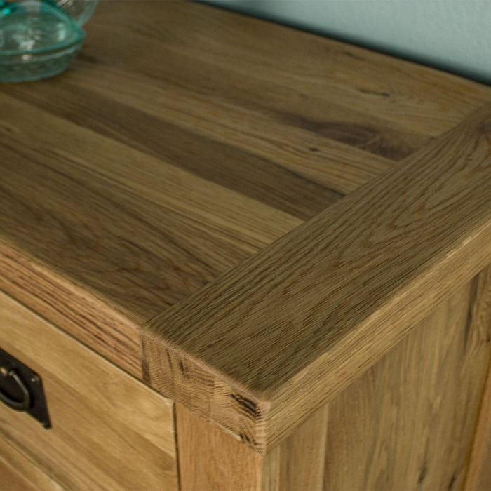 A close up of the top of the  Yes Five Drawer Oak Chest, showing the wood grain and colour.