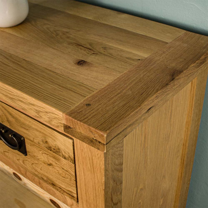 A close up of the top of the Yes Four Drawer Oak Lowboy, showing the wood grain and colour.