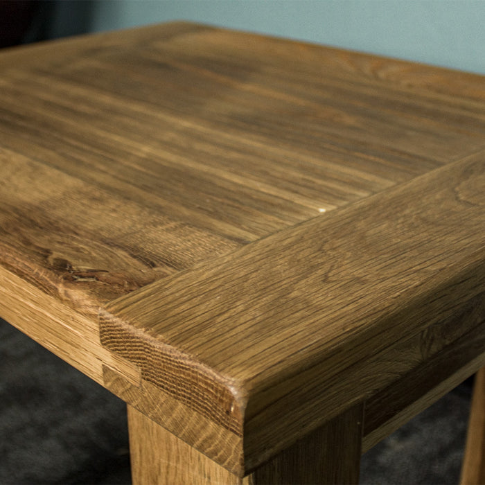 A close up of the top of the Amstel Oak Nesting Tables, showing the wood grain.