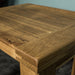 A close up of the top of the Amstel Oak Nesting Tables, showing the wood grain.