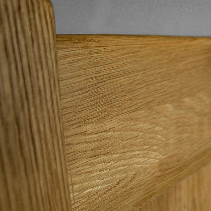 A close up of the wood grain and texture of the Amalfi Oak Queen Bed Frame