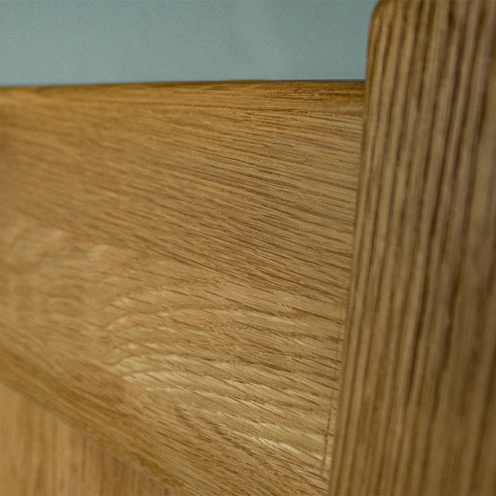 A close up of the wood grain and texture of the Amalfi Super King Oak Bed Frame