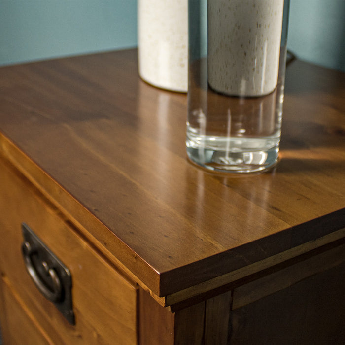 A close up of the top of the Montreal Pine Bedside Cabinet, showing the wood grain and colour.