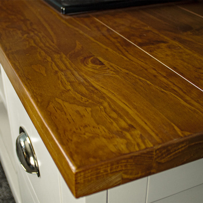 A close up of the top of the Alton Entertainment Unit, showing the wood grain and colour.