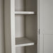 A closer view of the shelving on the side of the top of the Biarritz Two-piece Wardrobe.