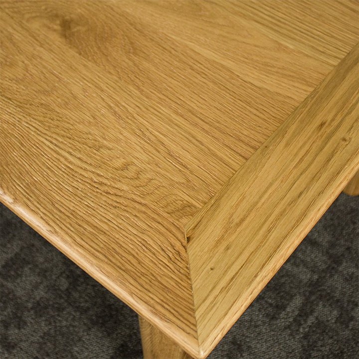 The top of the Boston Oak Extending Dining Table - Natural Oak, showing the wood grain and colour.