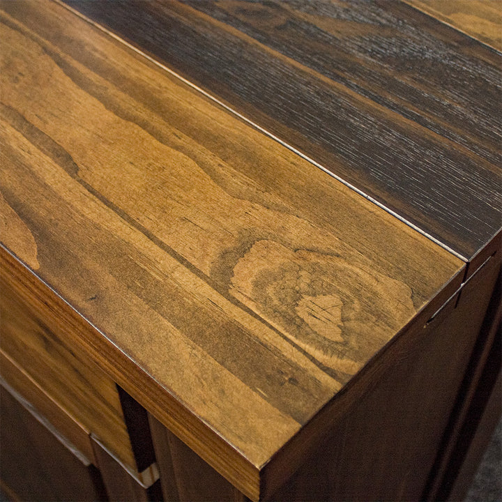 A close up of the top of the Botanica 3-Drawer Large Buffet, showing the wood grain and colour.