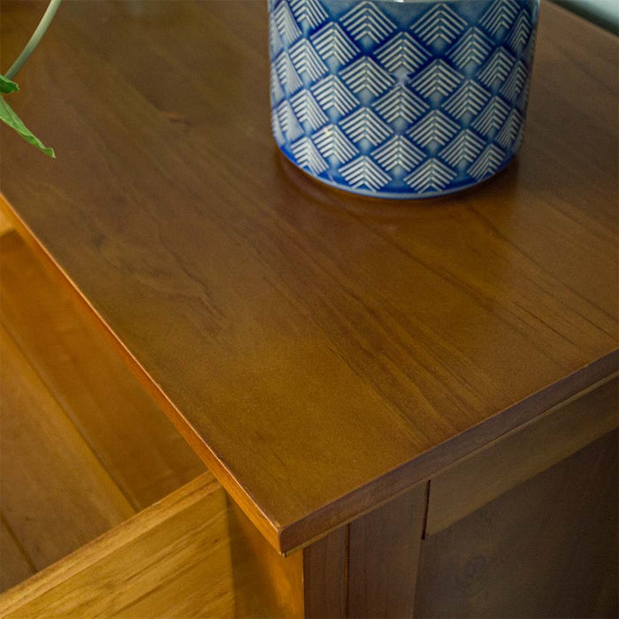 A close up of the top of the Rimu stained Montreal 2 Drawer Pine Buffet.