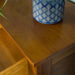 A close up of the top of the Rimu stained Montreal 2 Drawer Pine Buffet.