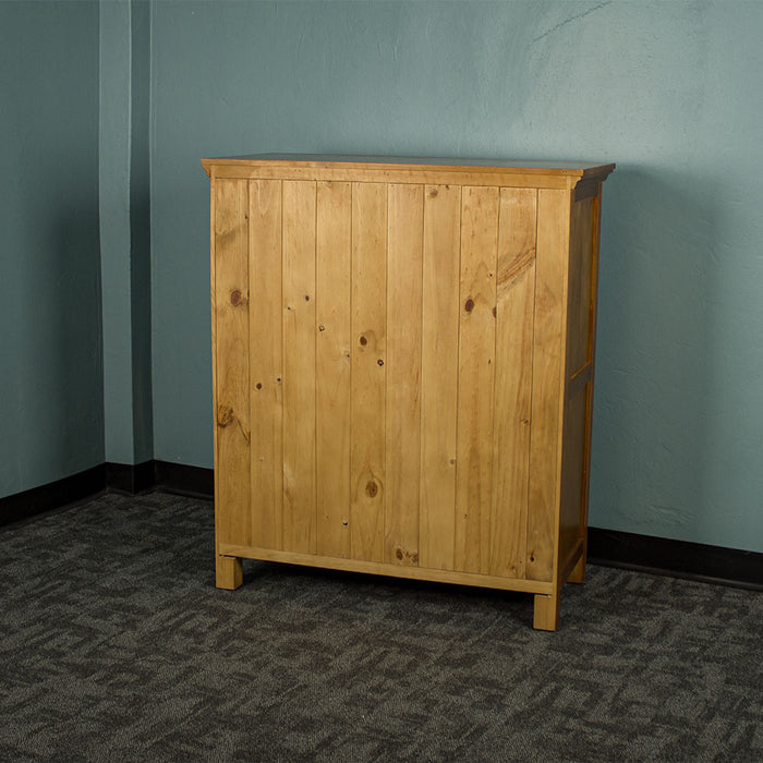 The solid back panelling of the Montreal Five Drawer Pine Tallboy.