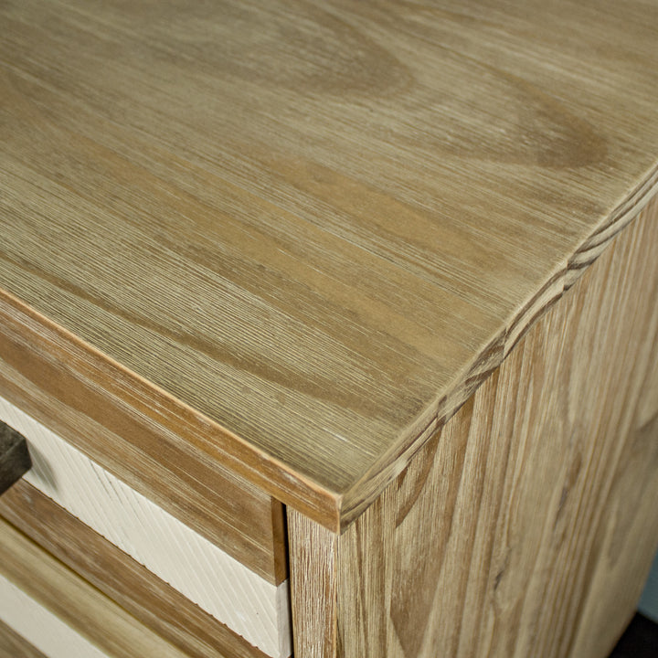 A close up of the top of the Soho 3 Drawer NZ Pine Large Buffet, showing the wood grain and colour.