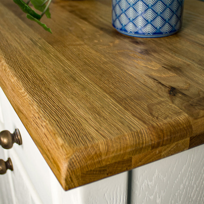 A close up of the top of the Loire Small Oak Buffet, showing the wood grain and colour.