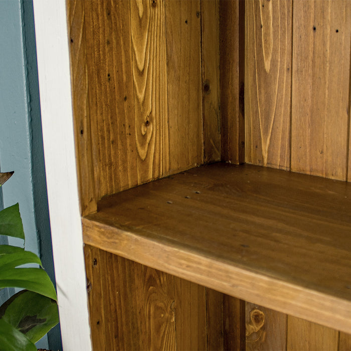 Close up of the brown interior shelving on the Tuscan Recycled Pine Tall Bookcase.