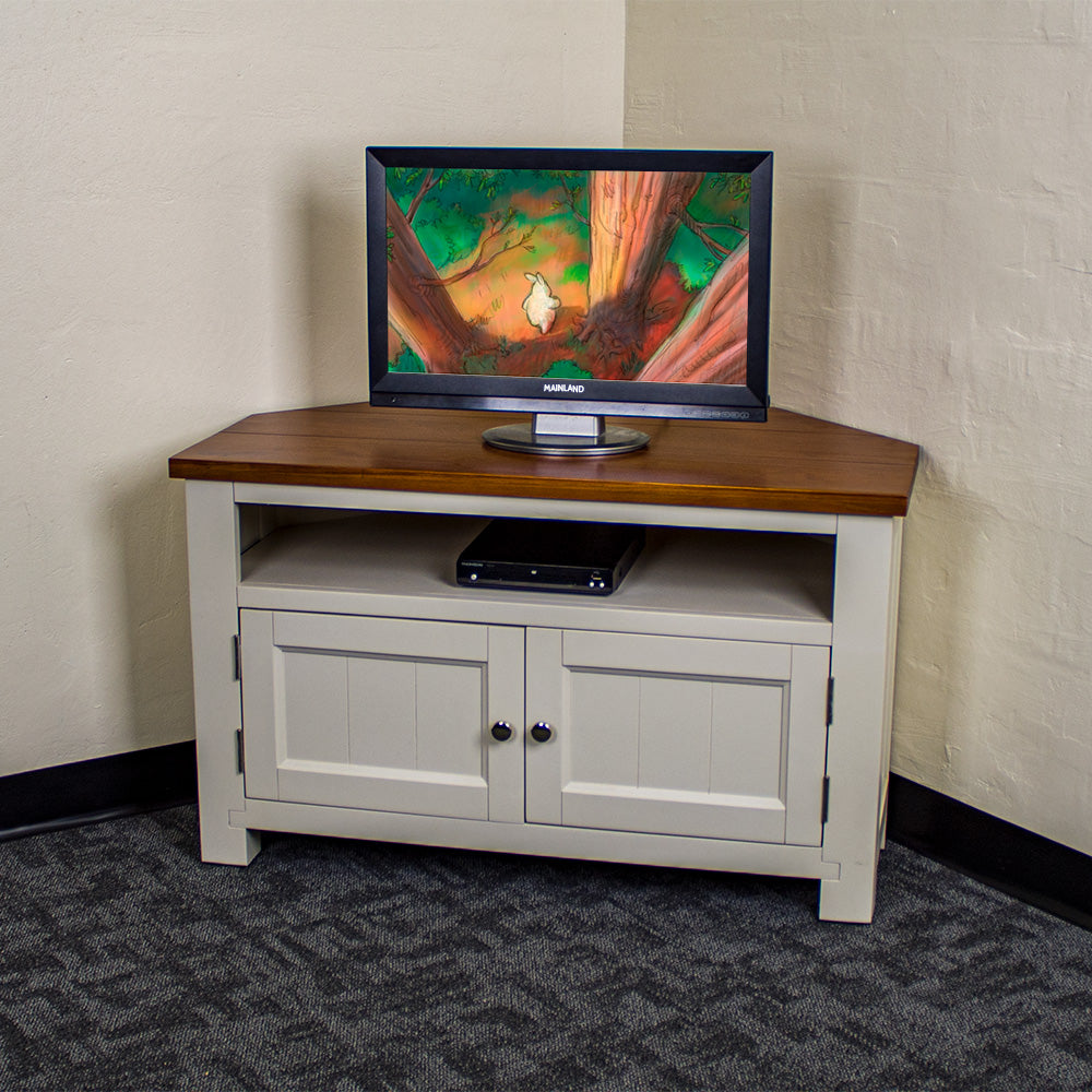 The front of the Alton Corner TV Unit. There is a small TV on top and a DVD player in the shelf.