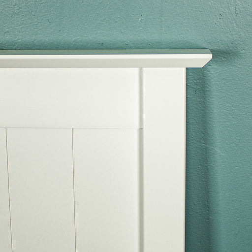 A close up of the corner of the Hamilton Queen Size Pine Headboard.