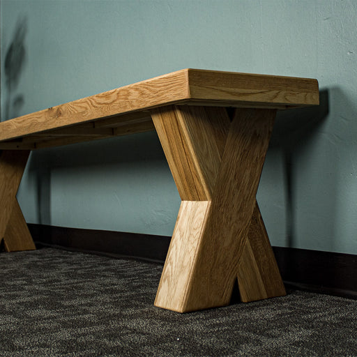 A closer view of the cross legs on the Maximus Oak Cross Leg Bench Seat (1.9m)