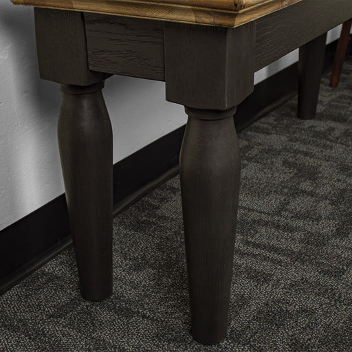 A view of the legs on the Boston Short Oak Bench.