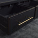 A close up of the gold coloured metal handles on the Cascais Large Bookcase.