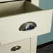 A close up of the round chrome/silver handle on the Alton 5 Drawer Lingerie Chest