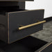 A close up of the gold coloured metal handle on the drawers of the Cascais 3 Drawer Black Bedside Table.