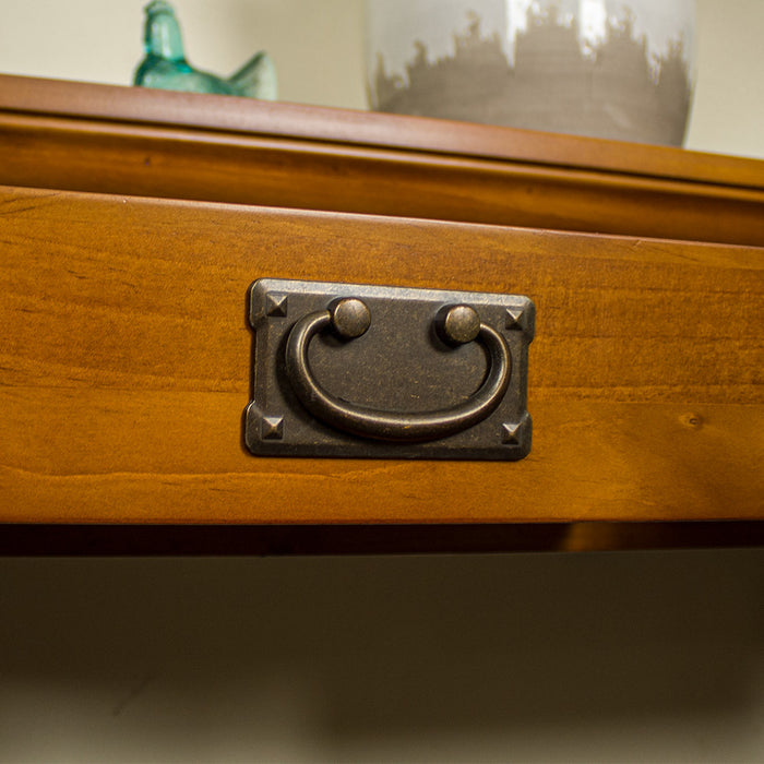 A close up of the handle on the drawer on the Montreal Pine Hall Table.
