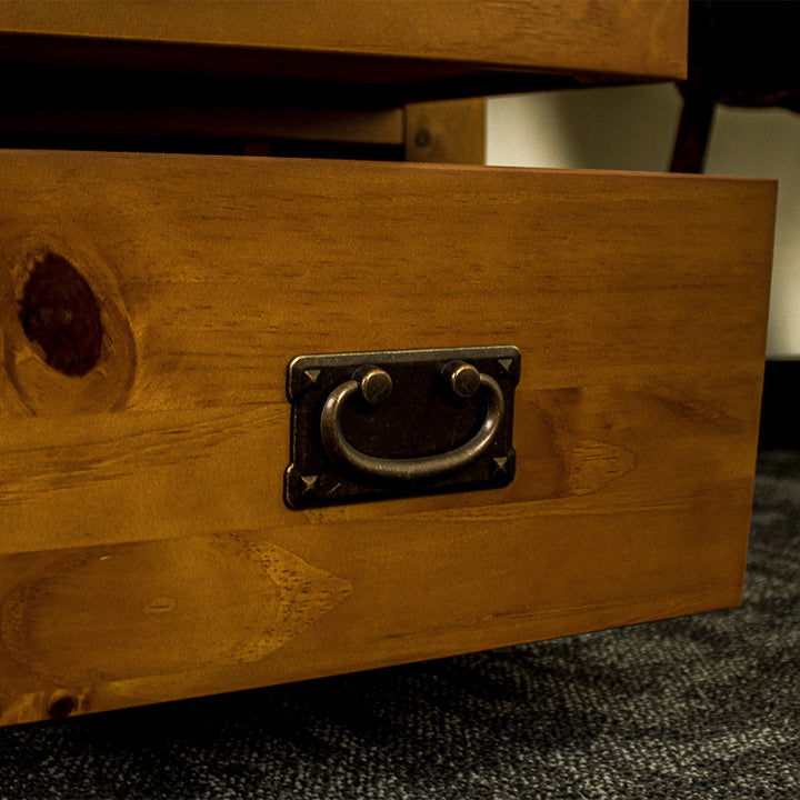 A close up of the brushed black metal handle on the drawers of the New Quebec 6 Drawer Lingerie Chest.