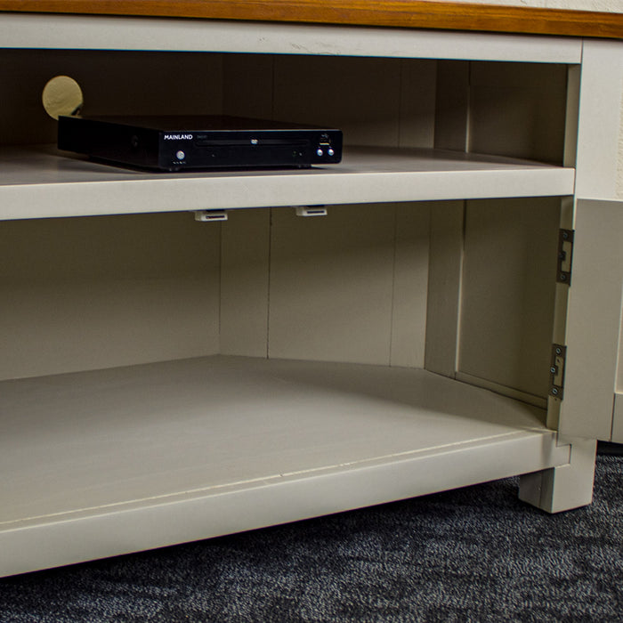 Inside of the Alton Corner TV Unit's lower cabinet.