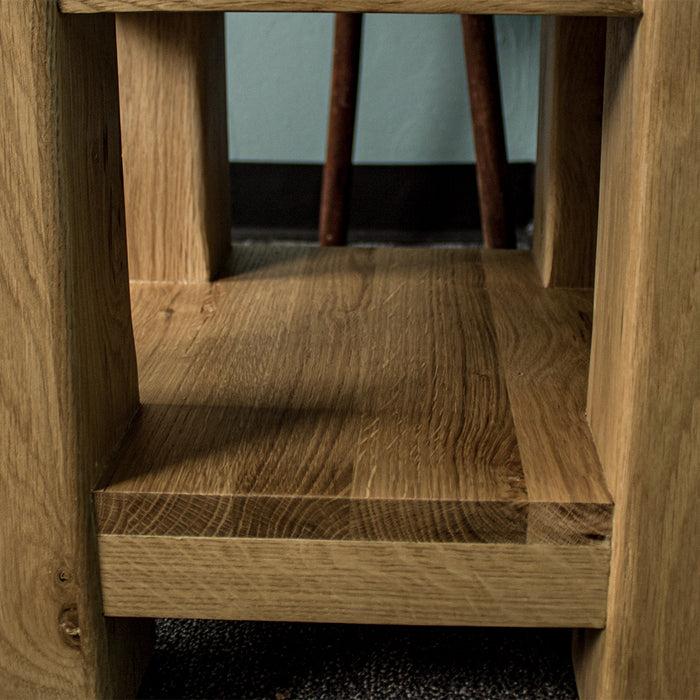 A view from the side of the shelf under the Camden Oak Lamp Table.