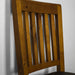 A closer view of the bar-style slat framing of the Hamilton Rimu Stained NZ Pine Dining Chair