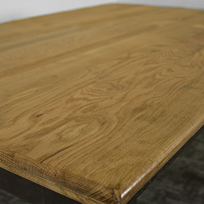 A close up of the top of the Boston Oak Dining Table, showing the colour and wood grain.