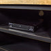 A view of the middle shelves, showing the easy access cable hole. There is a DVD player on the shelf.