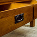 A close up of the black metal handle on the drawers of the Montreal Coffee Table with 2 Drawers