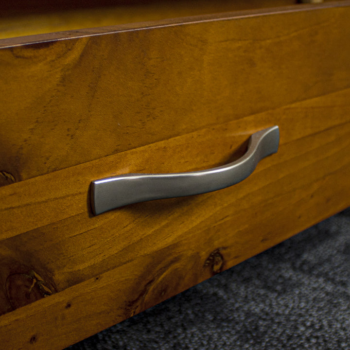 A close up of the silver metal handle on the drawer of the Monaco Bookcase