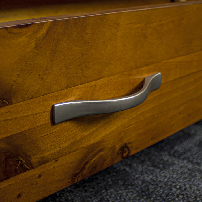 A close up of the silver metal handle on the drawer of the Monaco Bookcase