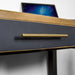 A close up of the gold coloured metal handle on the drawer of the Cascais Black Desk.