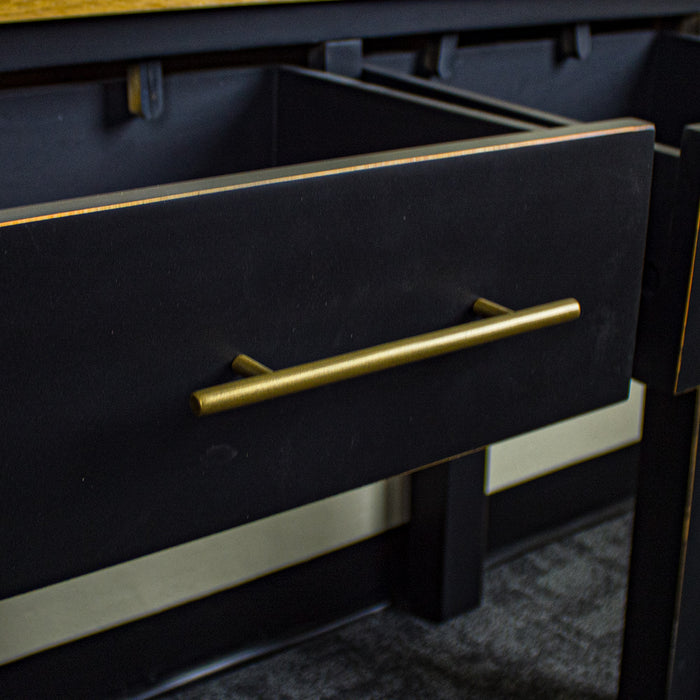 A close up of the gold coloured metal handle on the Cascais 2-Drawer Hall Table.