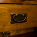 A close up of the drawer handle on the Montreal Small Pine Buffet.