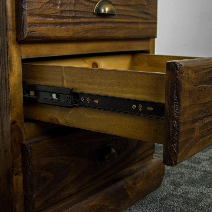 The metal runners on the drawers of the Heid Large 3 Drawer Pine Bedside