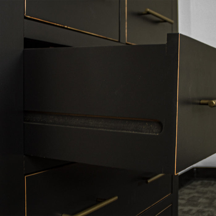 A close view of the free flowing runners on the drawers of the Cascais Oak Top Black Tallboy.